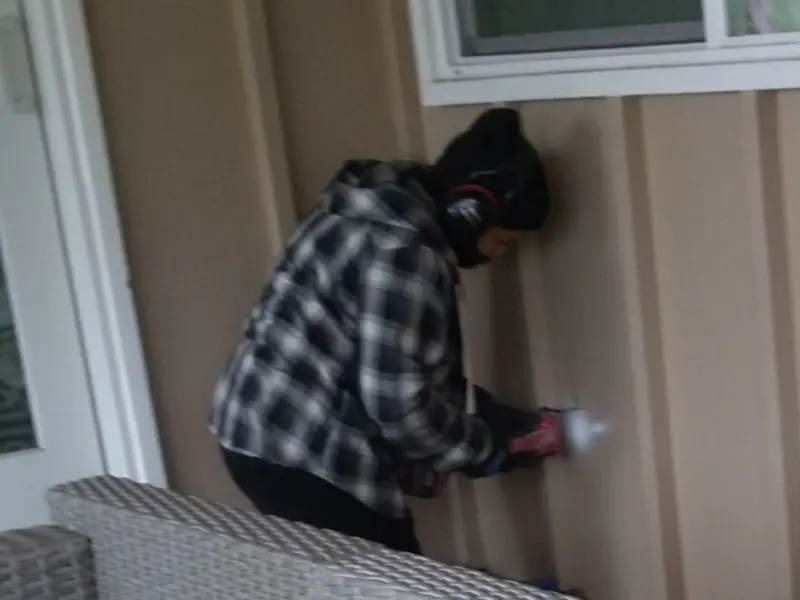 Professional electrician installing an exterior outlet in Cicero